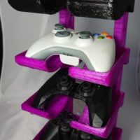3D printed game controller stand with selection of controllers 3D printed game controller stand with selection of controllers